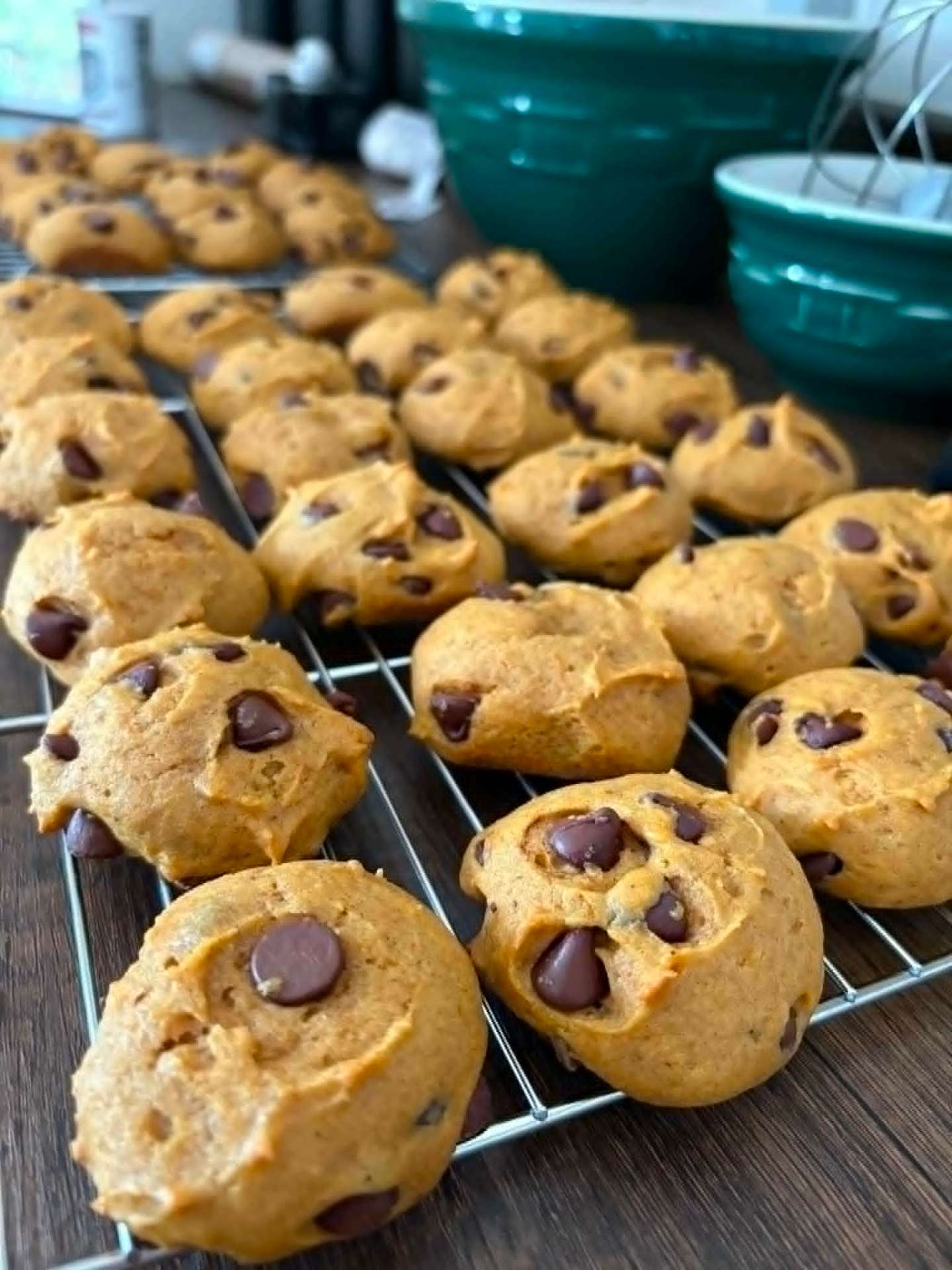 Soft pumpkin chocolate chip cookies on a cooling rack